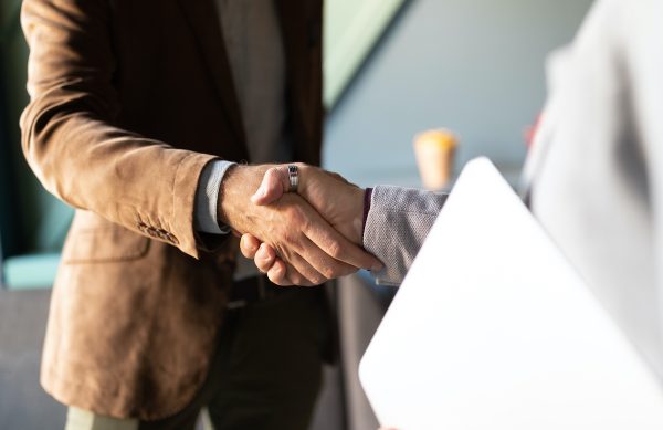 Business handshake and successful business people concept. Partnership, deal, agreement.