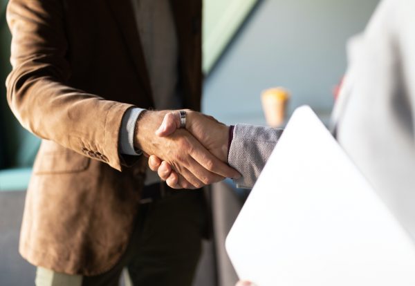 Business handshake and successful business people concept. Partnership, deal, agreement.